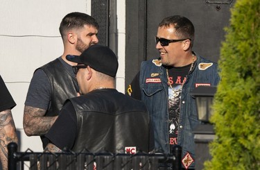 Members of the Hells Angels gather in the front yard at the Nanaimo Hells Angels' clubhouse in Nanaimo, BC, July, 20, 2018.
