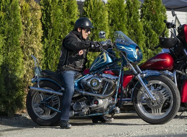 A member of the Hells Angels arrives at the Nanaimo Hells Angels' clubhouse in Nanaimo, BC, July, 20, 2018.