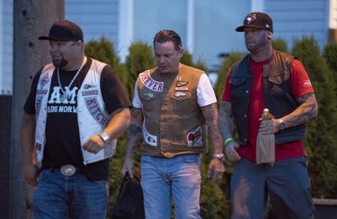 Members of the Hells Angels arrive at the Nanaimo Hells Angels' clubhouse in Nanaimo, BC, July, 20, 2018.