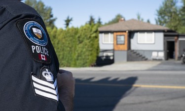 NANAIMO,BC:JULY 20, 2018 -- A member of The Combined Forces Special Enforcement Unit of British Columbia monitors the Nanaimo Hells Angels clubhouse in Nanaimo, BC, July, 20, 2018. (Richard Lam/PNG) (For Kim Bolan) 00054056A [PNG Merlin Archive]
