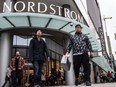 More than 960 employees cheer as costumers enter the store during Nordstrom's Grand Opening at Pacific Centre in Vancouver, B.C., Friday September 18, 2015,  Nordstrom officially opens its doors to its third Canadian store and first international flagship store at Pacific Centre. Photo by Carmine Marinelli.