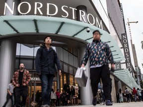 More than 960 employees cheer as costumers enter the store during Nordstrom’s Grand Opening at Pacific Centre in Vancouver on Sept. 18, 2015. Photo by Carmine Marinelli.
