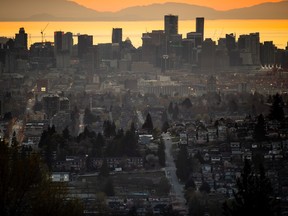 The downtown Vancouver skyline is seen at sunset.