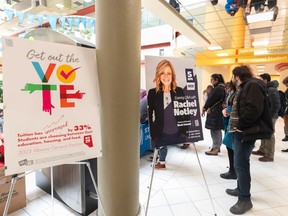 University of Calgary students stand in line to sign up to receive information about the upcoming provincial election, on March 27.