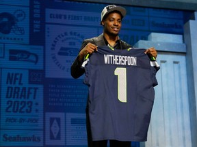 Devon Witherspoon poses after being selected fifth overall by the Seattle Seahawks during the first round of the 2023 NFL Draft at Union Station on April 27, 2023 in Kansas City, Missouri.