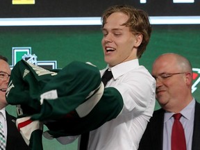 Filip Johansson reacts after being selected 24th-overall by the Minnesota Wild during the first round of the 2018 NHL Draft at American Airlines Center on June 22, 2018 in Dallas, Texas.