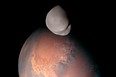 This image released by the Emirates Mars Mission shows Mars' moon Deimos in the foreground.