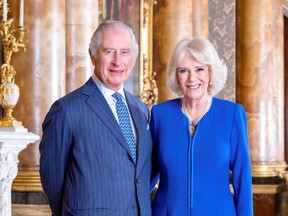Handout photo dated March 2023 issued by Buckingham Palace of King Charles III and Camilla, the Queen Consort taken by Hugo Burnand in the Blue Drawing Room at Buckingham Palace, London, released on April 28, 2023.