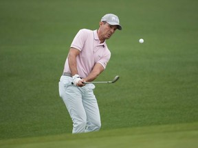 Mike Weir, of Canada, chips to the green on the second hole during the first round of the Masters at Augusta National Golf Club on Thursday, April 6, 2023, in Augusta, Ga.