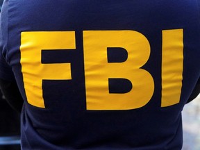 An FBI logo is pictured on an agent's shirt in the Manhattan borough of New York October 19, 2021.