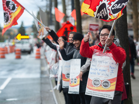 Hundreds of Public Service Alliance of Canada workers picket the Canada Revenue Agency Surrey National Verification and Collection building on King George Blvd. in Surrey, B.C.