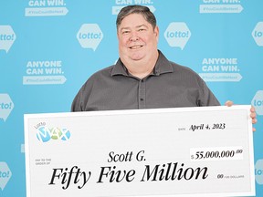 Scott Gurney of Sidney picked up his $55-million cheque on Tuesday, April 4, after winning the Feb. 28 Lotto Max draw.