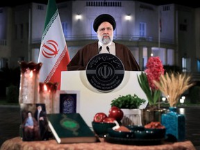 A handout picture provided by Iranian presidency on March 20, 2023 shows Iran's President Ebrahim Raisi delivering a televised speech on the Persian New Year Nowruz in Tehran.