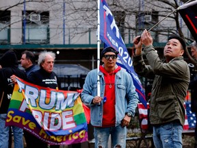 Supporters of former US president Donald Trump protest outside the Manhattan District Attorney's office in New York City on April 3, 2023. - Donald Trump arrived at his New York skyscraper on the eve of his surrender to face unprecedented criminal charges that threaten to throw the entire 2024 White House race into turmoil. The 76-year-old Republican, the first US president ever to be criminally indicted, will be formally charged on April 4, 2023 over hush money paid to a porn star during the 2016 election that brought him to power. (Photo by Leonardo Munoz / AFP)