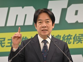 Taiwan Vice President and Chairman of ruling Democratic Progressive Party (DPP) William Lai gestures during his speech at the DPP headquarters in Taipei on April 12, 2023. - Lai will represent the DPP running for presidential elections in 2024. (Photo by Sam Yeh / AFP)