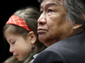 Former Northwest Territories Premier Stephen Kakfwi with his granddaughter Sadeya Kakfwi-Scott attend a Truth and Reconciliation Commission of Canada event in Ottawa June 2, 2015. The Truth and Reconciliation Commission of Canada presented its final report on the Indian Residential Schools.     REUTERS/Blair Gable