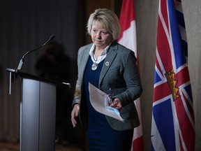 B.C. Provincial Health Officer Dr. Bonnie Henry steps away from the podium after speaking during a news conference in Vancouver, B.C., Monday, Jan. 30, 2023. Henry announced B.C. is lifting pandemic restrictions like mandatory mask-wearing in health-care settings and visitor restrictions and proof of vaccination in care homes.