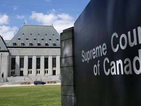 The Supreme Court of Canada is seen Wednesday, Aug. 10, 2022, in Ottawa. The Supreme Court of Canada is set to rule Friday on an appeal by two men found guilty of first-degree murder in a mass gang slaying of six people in Metro Vancouver more than 15 years ago.