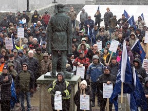 Members of the FFAW (Fish, Food and Allied Workers Union) and their supporters rally at the Confederation Building in St. John's, Monday, April 17, 2023. As a standoff in Newfoundland and Labrador's crab fishery enters its third week, the union representing inshore fishers says it's keeping an eye on the Maritimes, where harvesters have started to fish.