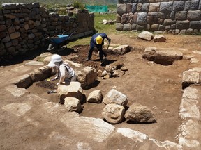 Archaeologists work in the remains of an ancient ceremonial Inca bathroom, discovered in a sector known as Inkawasi (House of the Inca), at the archaeological site Huanuco Pampa, in Huanuco, Peru March 20, 2023. Peru Culture Ministry/Handout