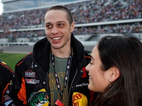 Pete Davidson and Chase Sui talk on the grid prior to the NASCAR Cup Series 65th Annual Daytona 500 at Daytona International Speedway on February 19, 2023 in Daytona Beach, Florida.
