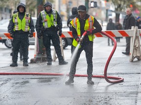 City work crews clean up East Hastings after the removal of tents and belongings that had been there for months.