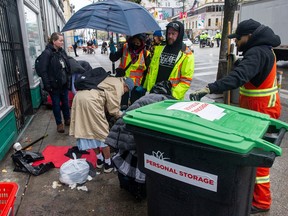 City works crews continue for the second day to clear the tent encampment along E. Hastings Street in Vancouver on Thursday. Photo: Jason Payne