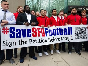 Current and past players of the SFU football program gather at B.C. Supreme Court in Vancouver earlier this past week.