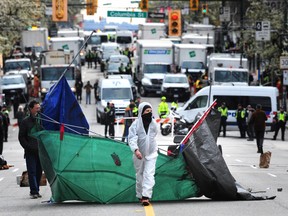 Scenes from E. Hastings St as the City of Vancouver remove tents with the Vancouver Police Department