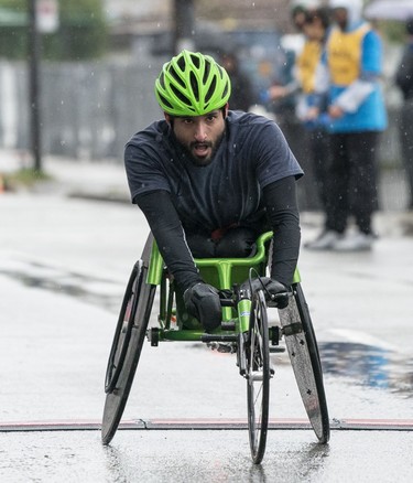 Balraj Zimich crosses the finish line in second place in the wheelchair division of the 2023 Sun Run in Vancouver on April, 16, 2023.