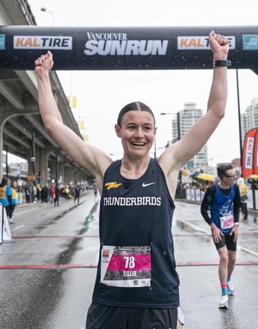 Leslie Sexton celebrates after crossing the finish line to win the women's division of the 2023 Sun Run in Vancouver on April, 16, 2023.