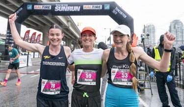 Leslie Sexton (left) celebrates after winning the women's division of the 2023 Sun Run with second place Malindi Elmore (middle) and third place Cleo Boyd, in Vancouver on April, 16, 2023.