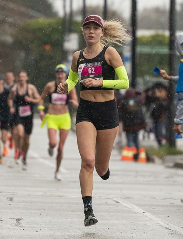 Ally Ginther runs to the finish of the 2023 Sun Run in Vancouver on April 16, 2023.