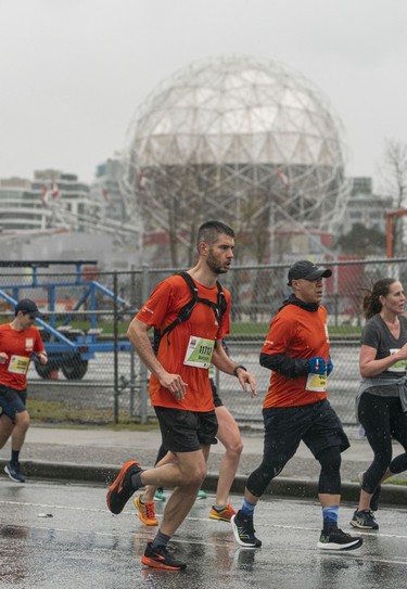 Runners run past Science World along Quebec Street and Pacific Blvd. in the 2023 Sun Run in Vancouver on April 16, 2023. (Richard Lam/PNG) (For ) 00100605A [PNG Merlin Archive]