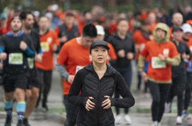 Runners make their way along Quebec Street in the 2023 Sun Run in Vancouver on April 16, 2023.