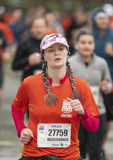 Alyssa Calero runs along the final stretch of the 2023 Sun Run in Vancouver on April 16, 2023.