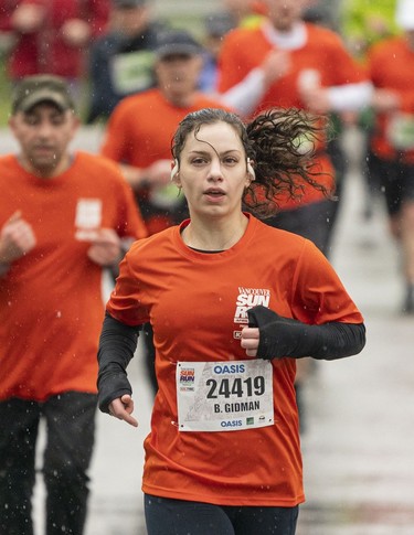 Bianca Gidman runs along Quebec Street in the 2023 Sun Run in Vancouver on April 16, 2023.