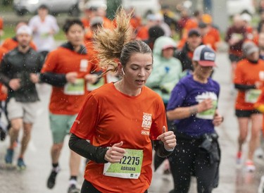 Adriana Taylor runs along Quebec Street in the 2023 Sun Run in Vancouver on April, 16, 2023.