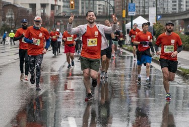 Cathal Dolphin runs along Quebec Street and Pacific Blvd during the 2023 Sun Run in Vancouver on April 16, 2023.