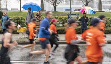 Spectators cheer on the runners in the 2023 Sun Run in Vancouver on April 16, 2023.