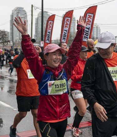 Sarah Chan crosses the finish line to complete the 2023 Sun Run in Vancouver on April 16, 2023.