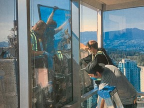 Photo of a crew installing a new window submitted in an affadavit from Amos Michelson, an original condo owner who sued the developers over glass windows at Vanocuver's Shangri-La Hotel before the case was certified as a class-action.