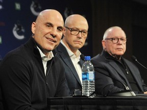 New Canucks head coach Rick Tocchet (left) with GM Patrik Allvin (middle) and team president Jim Rutherford at a press conference at Rogers Arena on Sunday, Jan. 22.