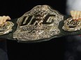 A UFC belt is held up during a news conference in Las Vegas, Thursday, Oct. 4, 2018. Jamey-Lyn Horth told herself she would move away from martial arts if she didn't make the UFC by the time she was 33. The unbeaten fighter from Squamish, B.C., finally got the call from the UFC six days before her 33rd birthday and Horth will make her UFC debut Saturday in Las Vegas.