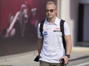 Haas driver Nikita Mazepin of Russia arrives to the Losail International Circuit in Losail, Qatar, Thursday, Nov. 18, 2021 ahead of the Qatar Formula One Grand Prix.