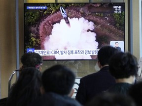 A TV screen shows a file image of North Korea's missile launch during a news program at the Seoul Railway Station in Seoul, South Korea, Wednesday, April 19, 2023. North Korean leader Kim Jong Un said his country has completed the development of its first military spy satellite and ordered officials to go ahead with its launch as planned, state media reported Wednesday.