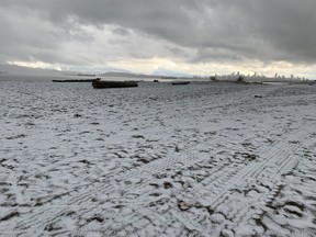 Accumulated ice and snow sits on Spanish Banks Beach in Vancouver on April 2, 2023.