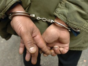 A suspect in handcuffs.
