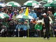 Tiger Woods of the United States reacts to his putt on the 18th green during the continuation of the weather delayed second round of the 2023 Masters Tournament at Augusta National Golf Club on April 8, 2023 in Augusta, Ga.