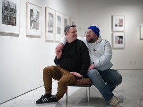 TikTok influencers, comedians Jeremy Baer, left, and Darcy Michael, a married couple from Ladner, B.C., pose for a photograph in Vancouver, on Friday, April 21, 2023.
